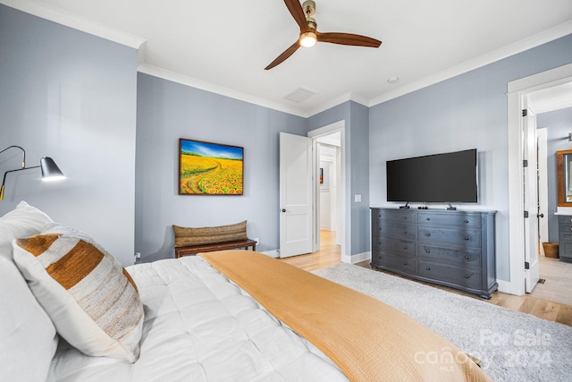 bedroom featuring ornamental molding, connected bathroom, light wood-type flooring, and ceiling fan