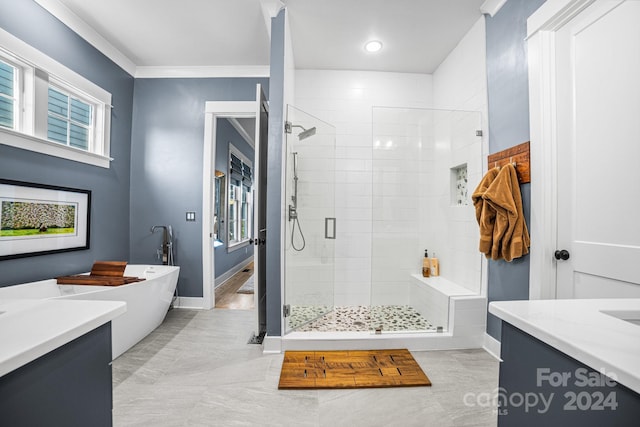 bathroom featuring vanity, crown molding, plus walk in shower, and tile patterned flooring