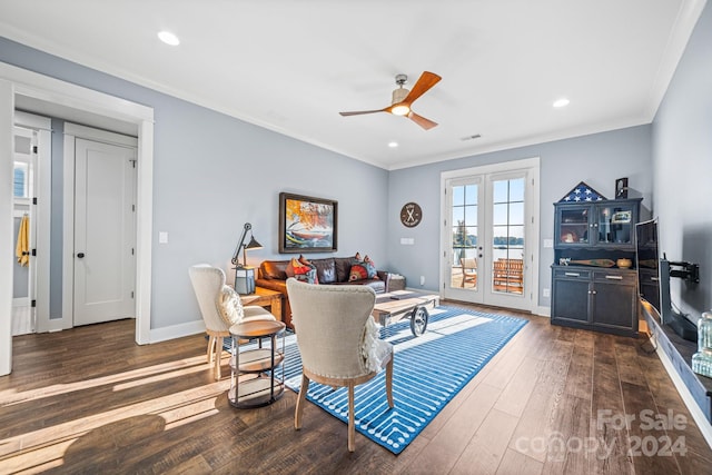 living room featuring french doors, crown molding, dark wood-type flooring, and ceiling fan