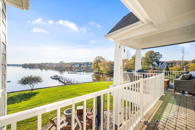 balcony featuring a water view