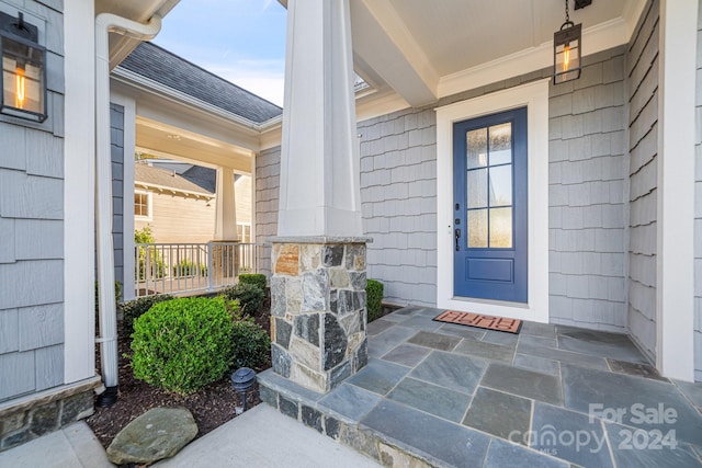 entrance to property with covered porch