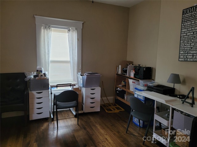 home office with dark wood-type flooring