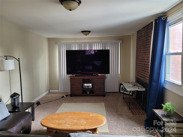 living room featuring light colored carpet and a healthy amount of sunlight