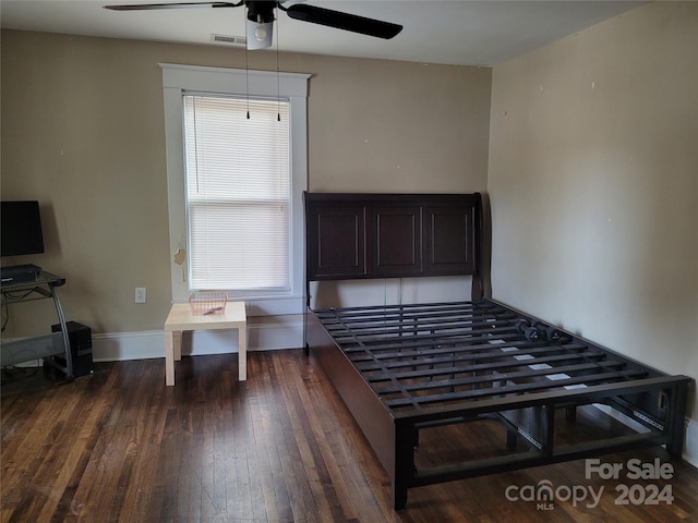 unfurnished bedroom with dark wood-type flooring