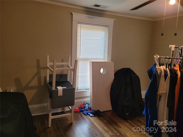 interior space with dark wood-type flooring and crown molding