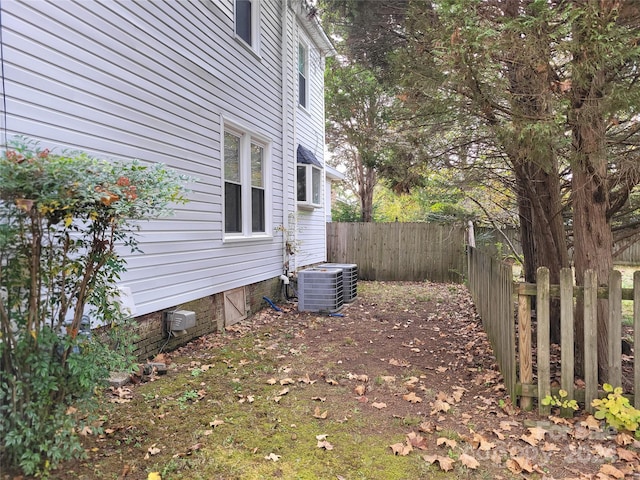 view of yard with central air condition unit