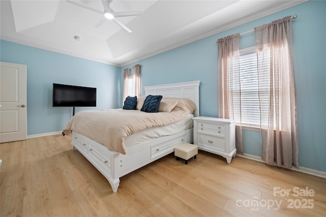 bedroom featuring multiple windows, light wood-style flooring, and baseboards