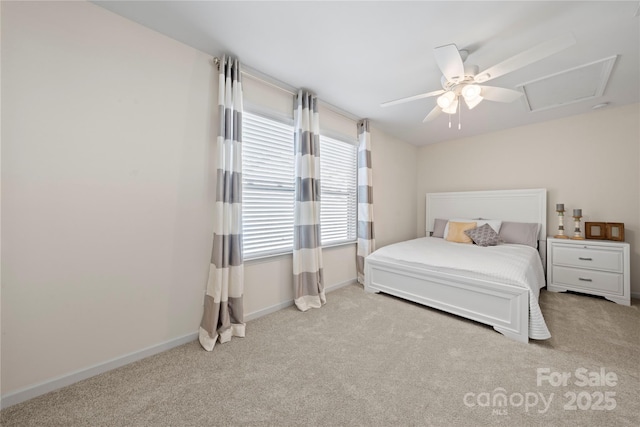 bedroom featuring carpet, attic access, ceiling fan, and baseboards