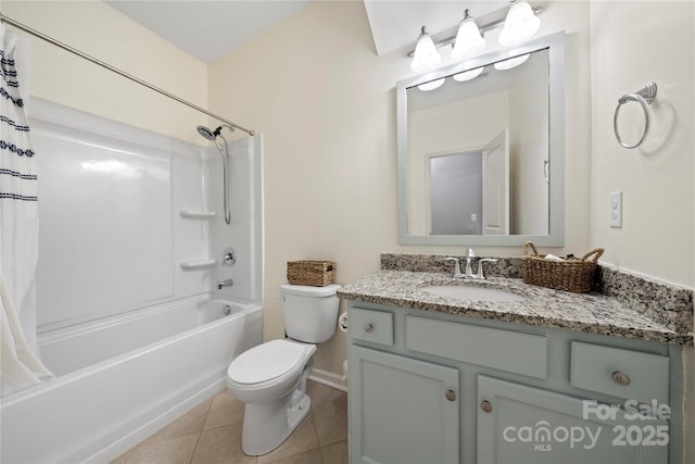 bathroom featuring toilet, shower / tub combo, vanity, baseboards, and tile patterned floors