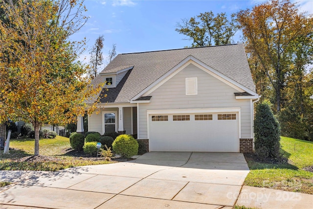 view of front of property with a garage, concrete driveway, brick siding, and roof with shingles