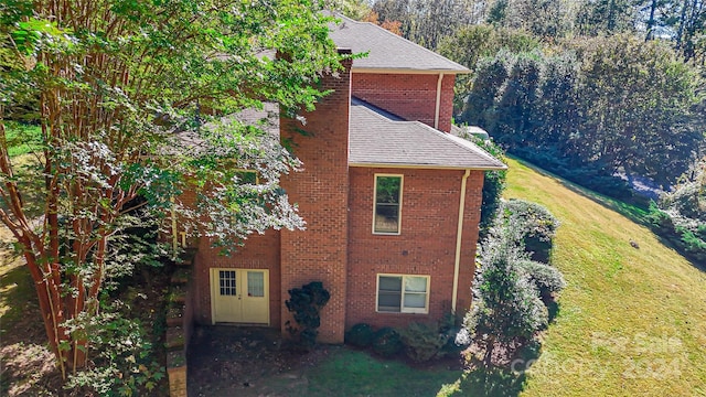 view of home's exterior featuring a lawn