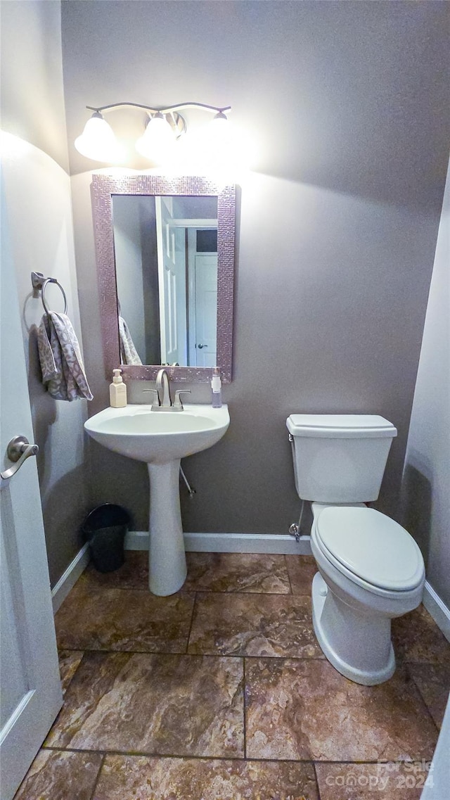 bathroom with toilet and sink