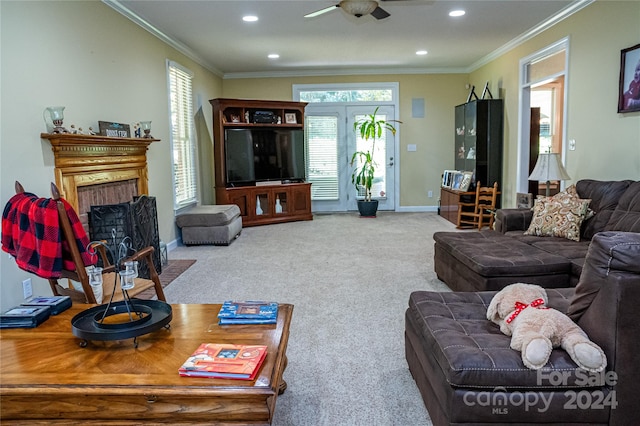 living room with ornamental molding and carpet floors