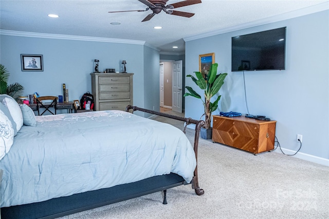 bedroom with ornamental molding, carpet, and ceiling fan