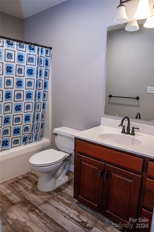 full bathroom featuring vanity, toilet, shower / tub combo with curtain, and hardwood / wood-style floors