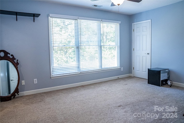 unfurnished bedroom with carpet flooring and ceiling fan