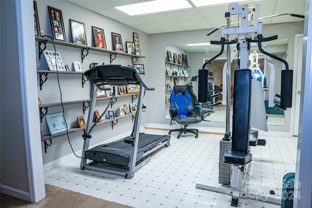 exercise room featuring a paneled ceiling