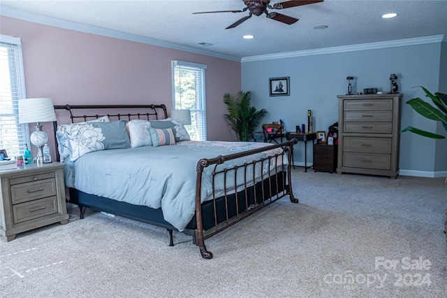 bedroom with ornamental molding, light carpet, a textured ceiling, and ceiling fan