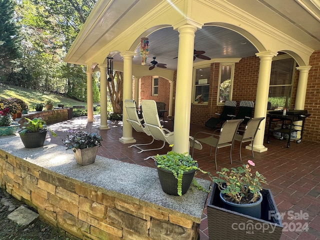 view of patio / terrace featuring ceiling fan