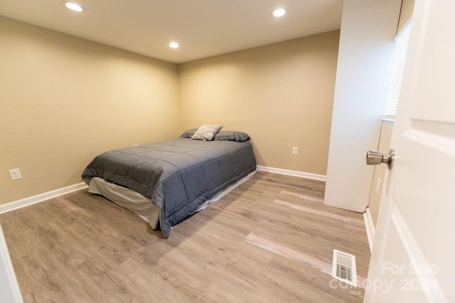 bedroom featuring light hardwood / wood-style floors