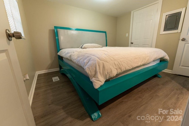 bedroom featuring dark wood-type flooring