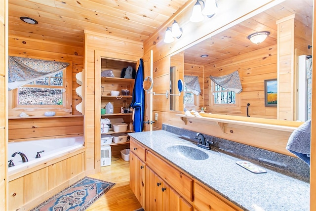 126 Bradley Ascent Ct, Hendersonville, NC 28792 - bathroom featuring wood ceiling, wood finished floors, wood walls, vanity, and a garden tub