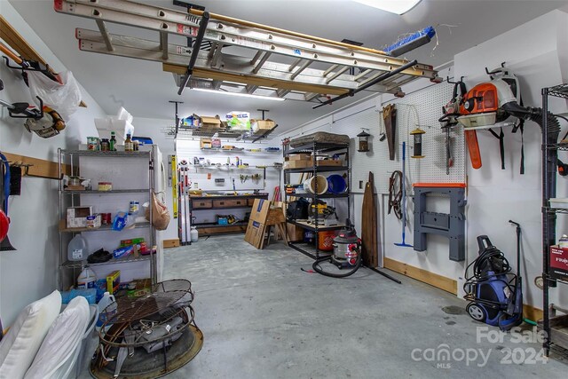 126 Bradley Ascent Ct, Hendersonville, NC 28792 - garage featuring a workshop area