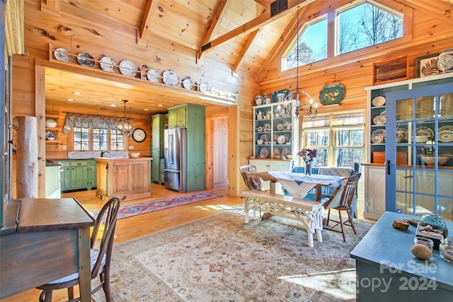 126 Bradley Ascent Ct, Hendersonville, NC 28792 - dining area featuring a chandelier, wood walls, light wood-type flooring, wood ceiling, and high vaulted ceiling