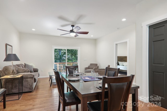 dining area with light hardwood / wood-style floors and ceiling fan