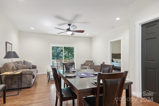 dining room featuring light hardwood / wood-style floors and ceiling fan