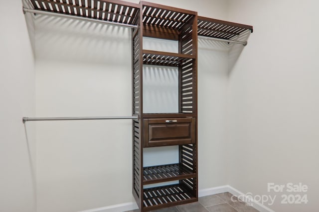 spacious closet with light tile patterned flooring