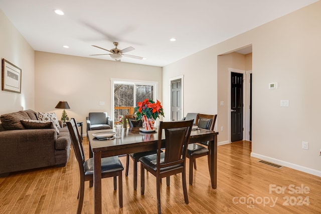 dining space featuring light hardwood / wood-style flooring and ceiling fan