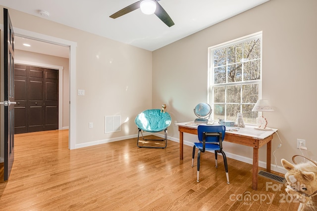 office area featuring light hardwood / wood-style flooring and ceiling fan