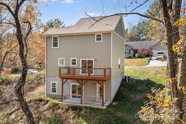 rear view of house with a lawn