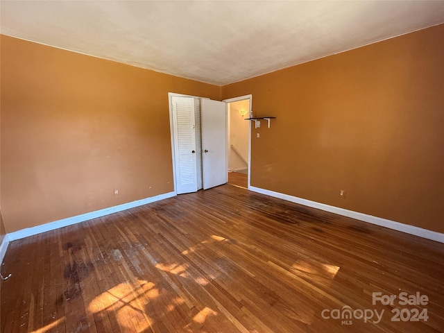 unfurnished bedroom with wood-type flooring