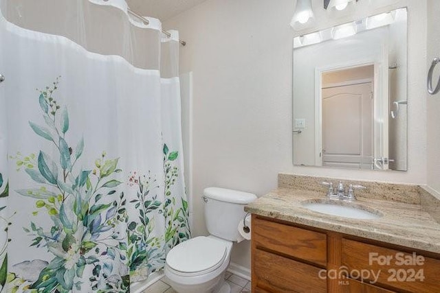 bathroom featuring vanity, toilet, and a shower with curtain