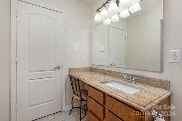 bathroom with vanity and tile patterned floors