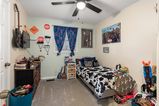 bedroom with ceiling fan and carpet