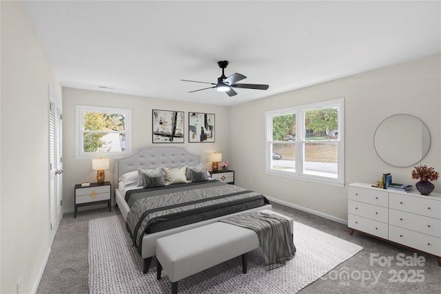 carpeted bedroom featuring ceiling fan