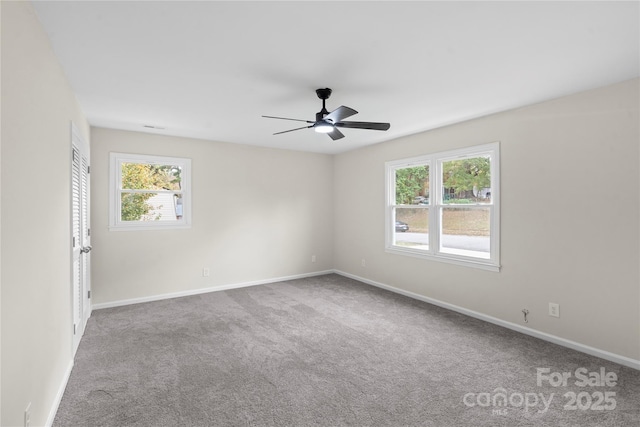 carpeted empty room with ceiling fan