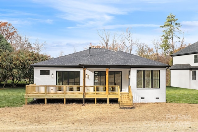 back of property featuring a yard and a wooden deck