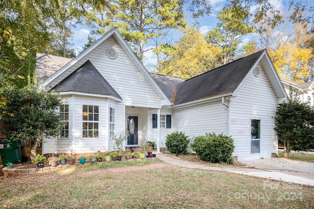 view of front of home with a front yard