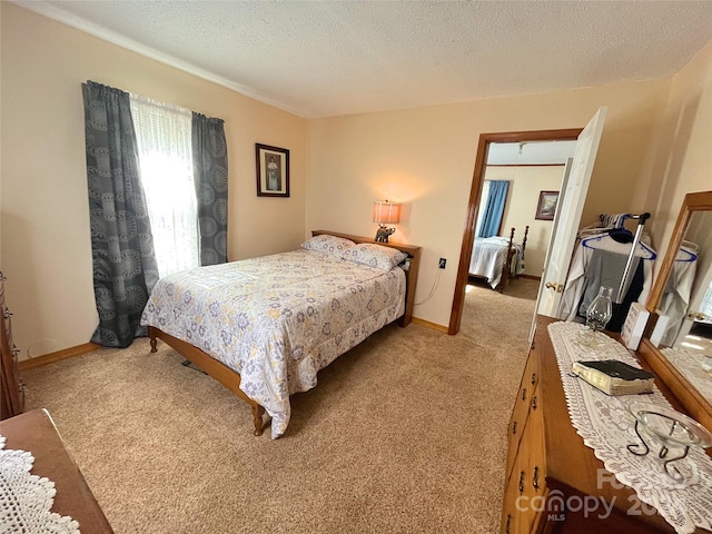 carpeted bedroom with a textured ceiling