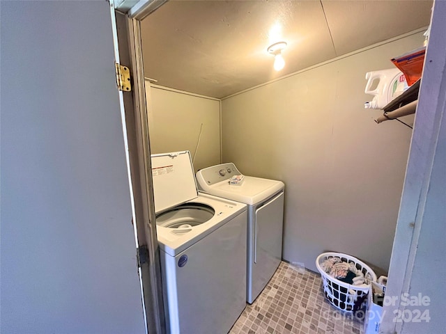 clothes washing area featuring washing machine and clothes dryer