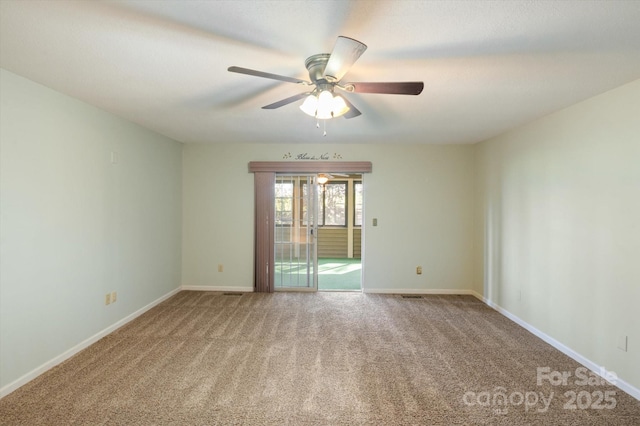 empty room with carpet, baseboards, and ceiling fan