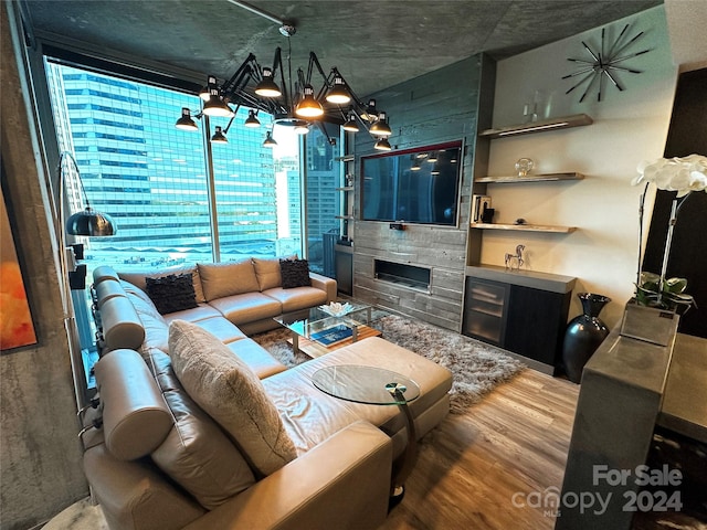 living room featuring hardwood / wood-style flooring and a chandelier