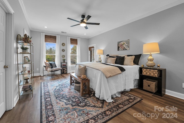 bedroom featuring ceiling fan, dark hardwood / wood-style flooring, and ornamental molding