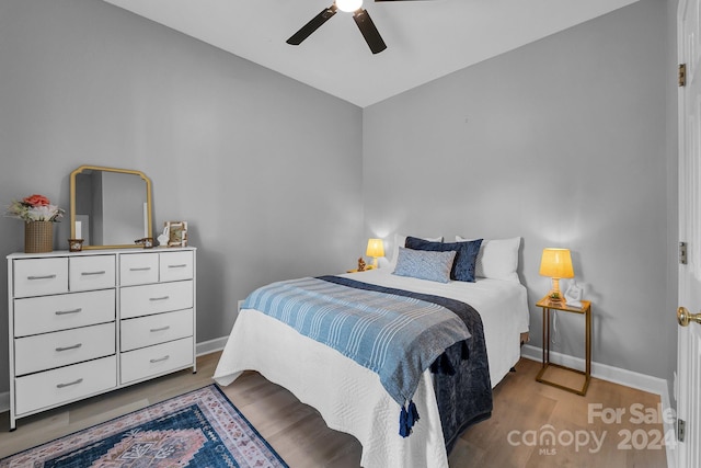 bedroom featuring ceiling fan and wood-type flooring