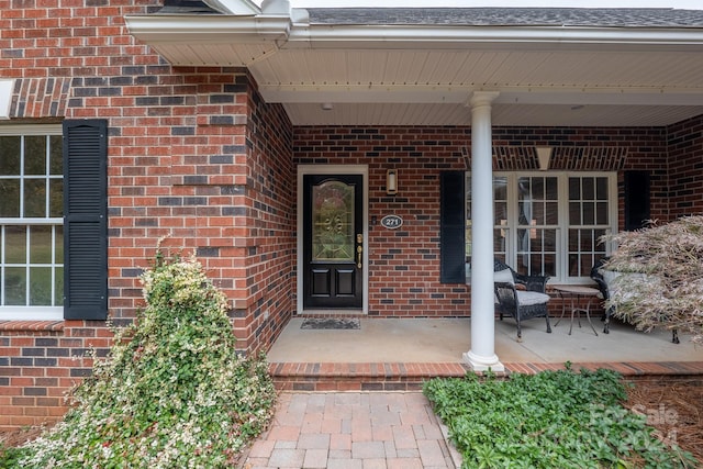 entrance to property featuring covered porch