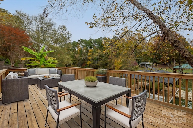 wooden terrace with an outdoor hangout area